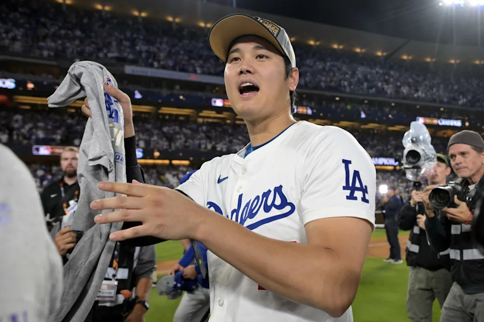 Oct 20, 2024; Los Angeles, California, USA; Los Angeles Dodgers designated hitter Shohei Ohtani (17) celebrates on the field after defeating the New York Mets in game six of the NLCS for the 2024 MLB playoffs to advance to the World Series at Dodger Stadium. Mandatory Credit: Jayne Kamin-Oncea-Imagn ImagesJayne Kamin-Oncea-Imagn Images