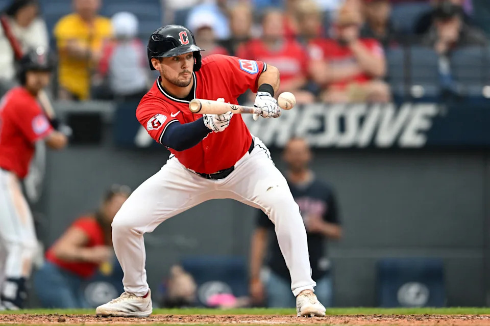 CLEVELAND, OHIO - JUNE 08: Will Wilson #7 of the Cleveland Guardians lays down an RBI sacrifice bunt during the seventh inning against the Houston Astros at Progressive Field on June 08, 2025 in Cleveland, Ohio. (Photo by Nick Cammett/Getty Images)