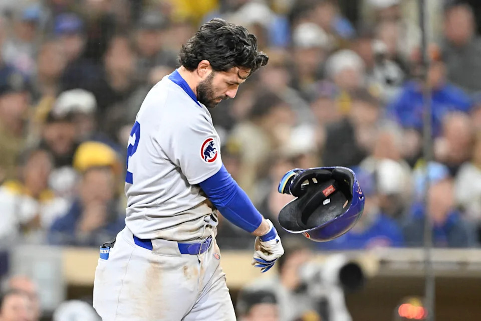 Chicago Cubs shortstop Dansby Swanson (7) throws his helmet after striking out during the ninth inning of against the San Diego Padres at Petco Park.Denis Poroy-Imagn Images