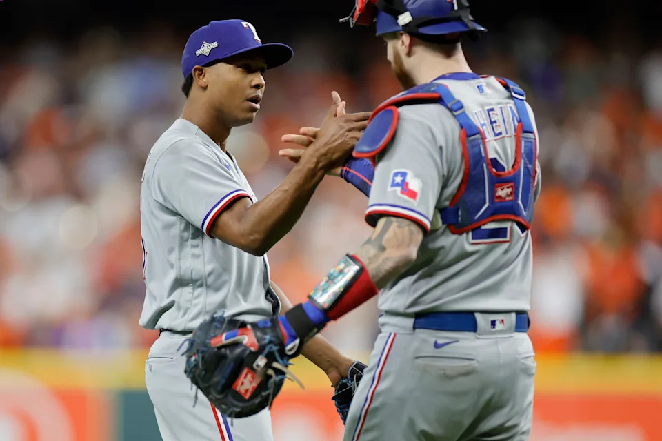 Jose Leclerc (left) has pitched the ninth inning in all seven of the Texas Rangers' victories this postseason. (Photo by Carmen Mandato/Getty Images)