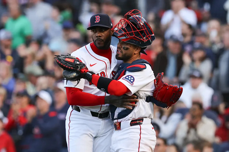 Boston Red Sox relief pitcher Aroldis Chapman (44) and Boston Red Sox catcher Carlos Narvaez (75) celebrate after defeating the St. Louis Cardinals at Fenway Park.Paul Rutherford-Imagn Images