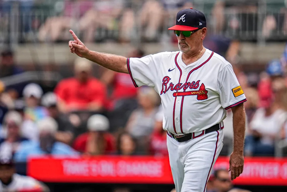 Atlanta Braves manager Brian Snitker (43) walks to the mound to change pitchers against the Arizona Diamondbacks during the ninth inning at Truist Park. IMAGN IMAGES via Reuters Connect
