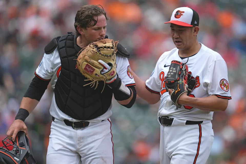May 15, 2025; Baltimore, Maryland, USA; Baltimore Orioles pitcher Tomoyuki Sugano (19) greeted by catcher Alley Rutschman (35) after the third inning against the Minnesota Twins at Oriole Park at Camden Yards.Mitch Stringer-Imagn Images