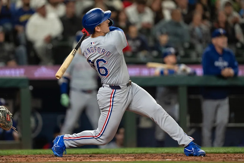 Texas Rangers outfielder Wyatt Langford hits a solo home run against the Seattle Mariners at T-Mobile Park on Sept. 13, 2024.Stephen Brashear-Imagn Images