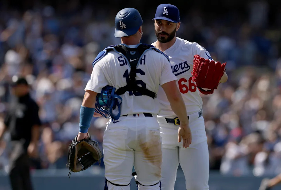 Los Angeles Dodgers pitcher Tanner Scott (66) and Los Angeles Dodgers catcher Will Smith (16) celebrate after defeating the New York Mets at Dodger Stadium.Jason Parkhurst-Imagn Images