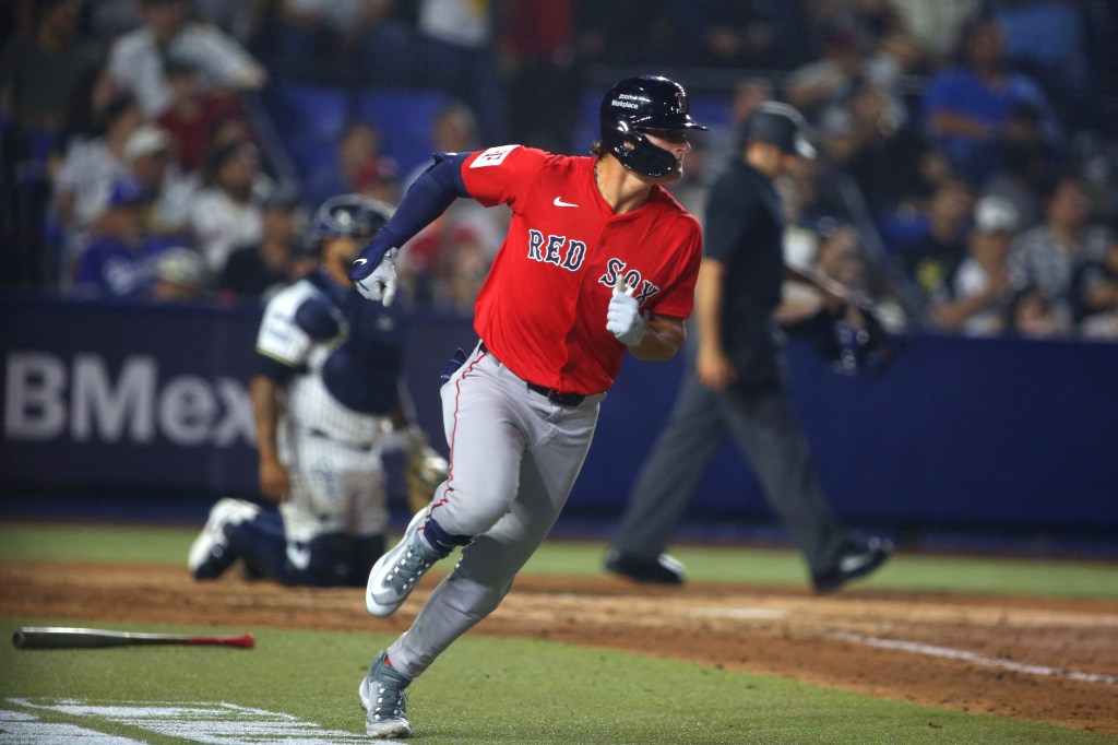 Red Sox player #48 running to first base.
