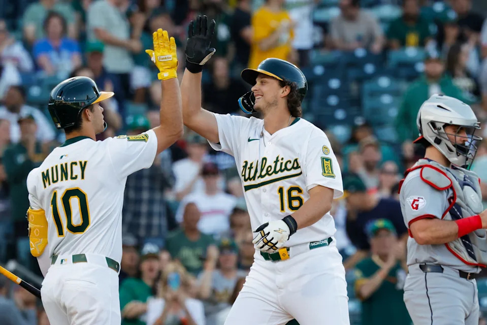 Athletics' Nick Kurtz (16) celebrates with third baseman Max Muncy (10) after hitting a two-run home run against the Cleveland Guardians on June 20, 2025, in West Sacramento, California.