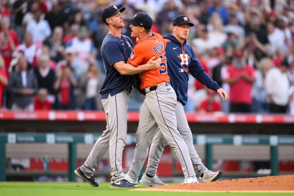 Houston Astros pitcher Hunter Brown, center, yells to Astros pitcher Hunter Brown after hitting Los Angeles Angels’ Zach Neto with a throw during the third inning of a baseball game Friday, June 20, 2025, in Anaheim, Calif. AP
