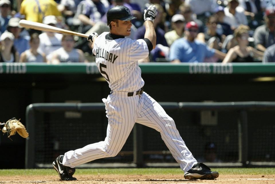 DENVER - MAY 2:  Outfielder Matt Holliday #5 of the Colorado Rockies swings at an Atlanta Braves pitch during the MLB game at Coors Field on May 2, 2004 in Denver, Colorado.  The Rockies won 13-4.   (Photo by Brian Bahr/Getty Images)