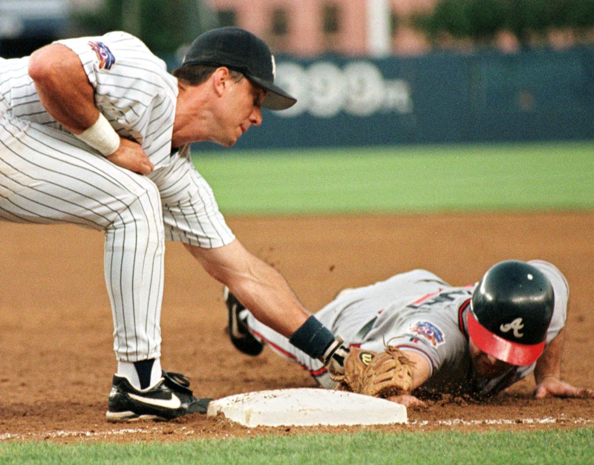 Tony Graffanino of the Atlanta Braves (R) is picke