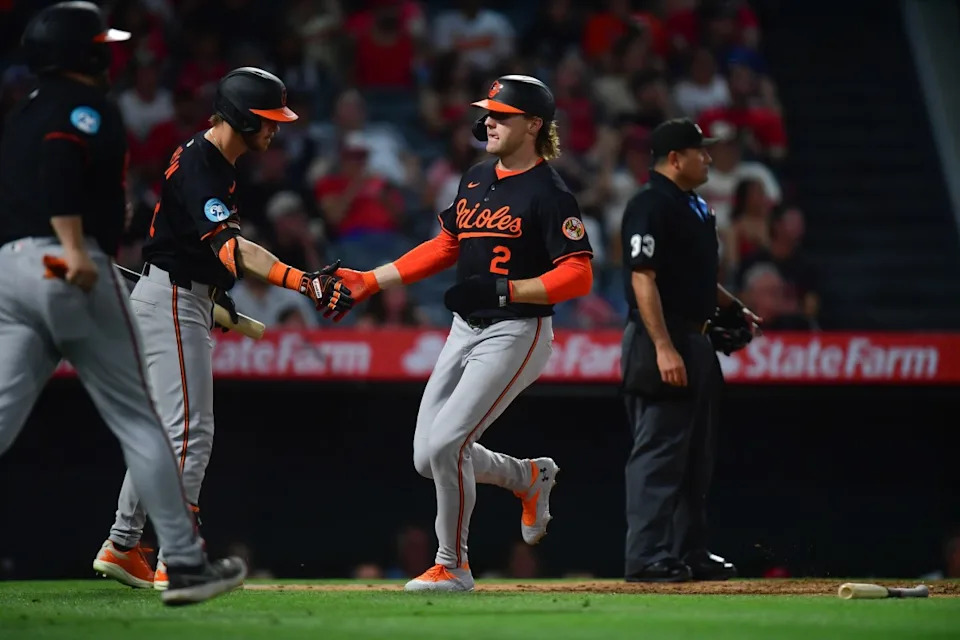 May 10, 2025; Anaheim, California, USA; Baltimore Orioles designated hitter Gunnar Henderson (2) is greeted by right fielder Ryan O'Hearn (32) after scoring a run against the Los Angeles Angels during the sixth inning at Angel Stadium.Gary A&period; Vasquez-Imagn Images