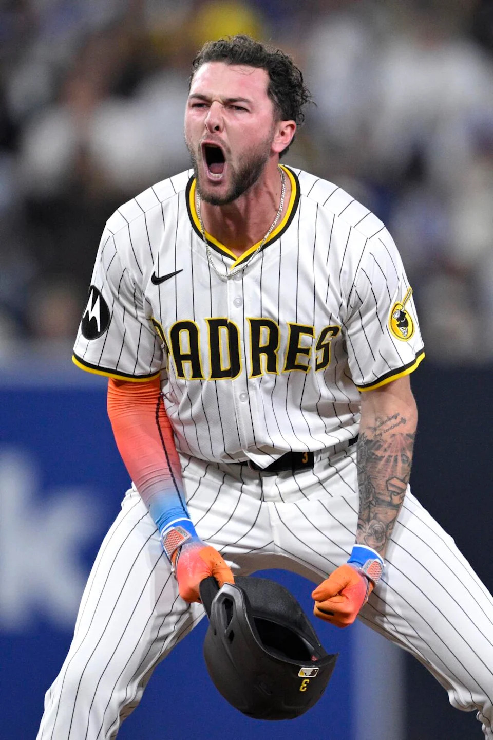 San Diego's Jackson Merrill celebrates after hitting an run-scoring double.