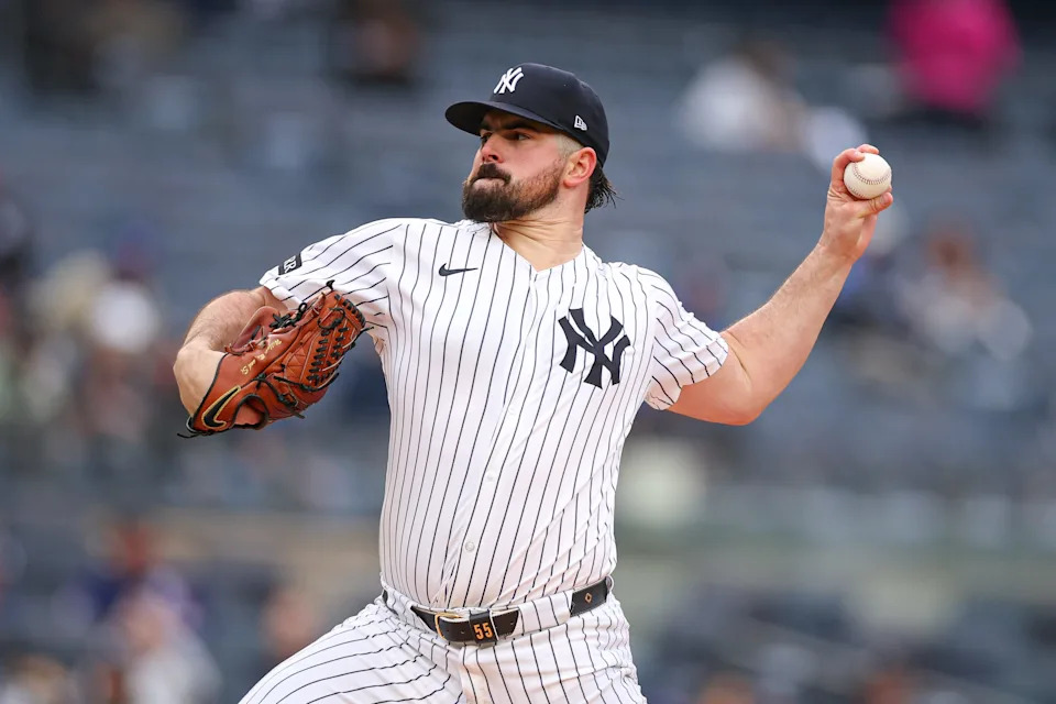 New York Yankees starting pitcher Carlos Rodon (55) delivers a pitch during the first inning against the Texas Rangers at Yankee Stadium in the Bronx, New York.