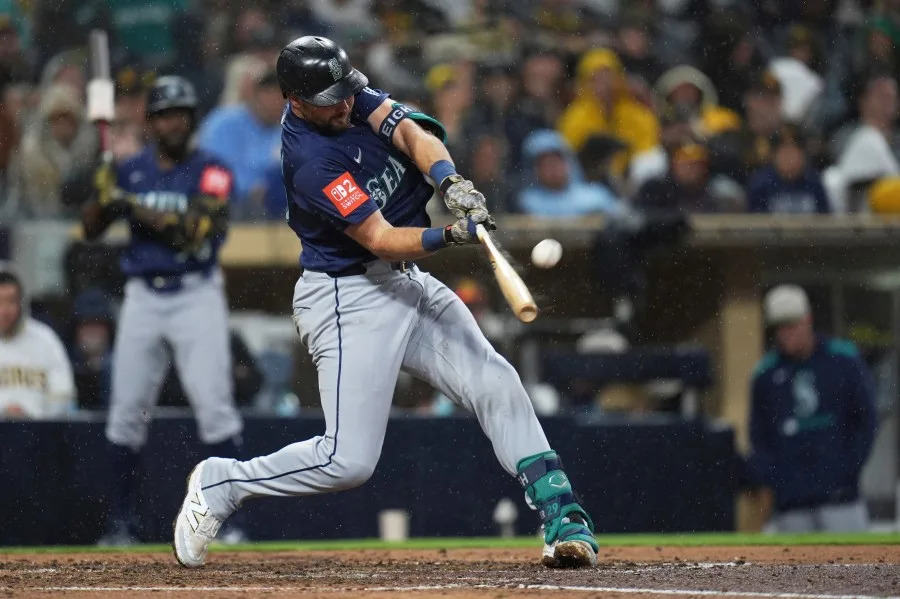 Seattle Mariners’ Cal Raleigh hits a home run during the seventh inning of a baseball game against the San Diego Padres Saturday, May 17, 2025, in San Diego. (AP Photo/Gregory Bull)