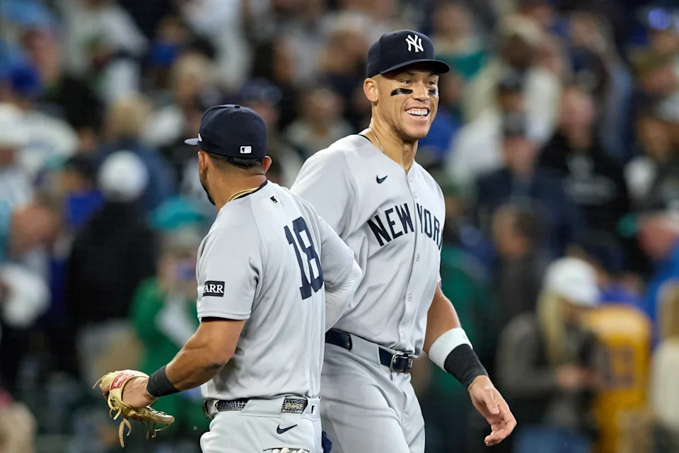 New York Yankees third baseman Oswald Peraza (left) and designated hitter Aaron Judge. John Froschauer-Imagn Images