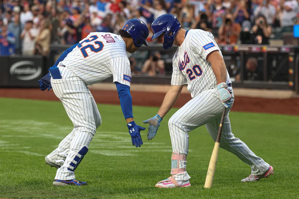 Mets right fielder Juan Soto (22) celebrates with first baseman Pete Alonso.Vincent Carchietta-Imagn Images