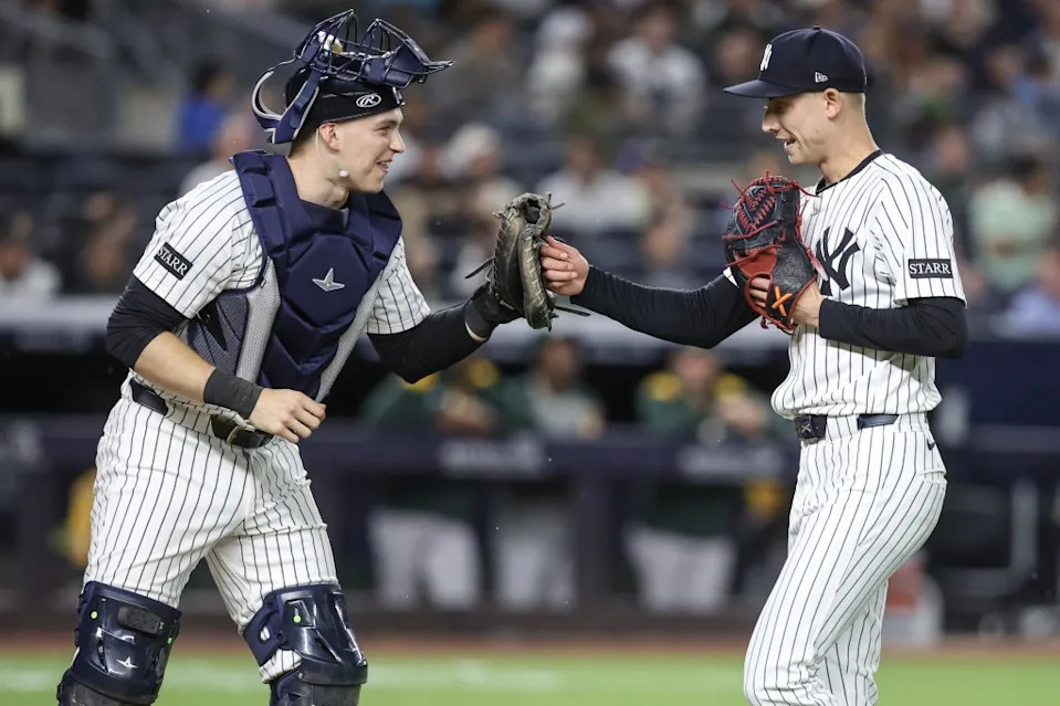 New York Yankees catcher Ben Rice (22) congratulates relief pitcher Luke Weaver (30) after retiring the side in the eighth inning against the Athletics at Yankee Stadium on June 27, 2025. Wendell Cruz-Imagn Images