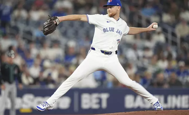 Toronto Blue Jays pitcher Eric Lauer (56) works against the Arizona Diamondbacks during the first inning of a baseball game in Toronto, Wednesday, June 18, 2025. (Frank Gunn/The Canadian Press via AP)