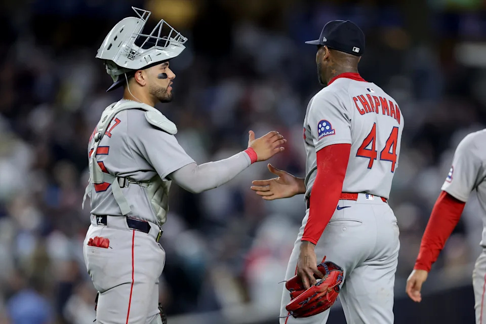 Jun 7, 2025; Bronx, New York, USA; Boston Red Sox catcher Carlos Narvaez (75) and relief pitcher Aroldis Chapman (44) celebrate after defeating the New York Yankees at Yankee Stadium. Mandatory Credit: Brad Penner-Imagn Images