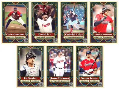 A set of fantasy-style baseball trading cards featuring Cleveland Guardians players, designed with a vintage Art Deco aesthetic. Each card shows a player in action with their name and team displayed in a stylized red and gold nameplate at the bottom. The players featured are Carlos Santana, David Fry, Gabriel Arias, Daniel Schneemann, Bo Naylor, Lane Thomas, and Nolan Jones. The design includes dark blue backgrounds, geometric gold framing, and red accents, evoking a classic and elegant feel.