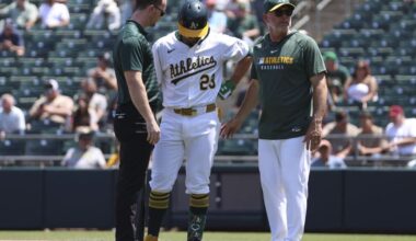 Athletics' Shea Langeliers exits vs. Twins after grabbing left side while batting | MLB
