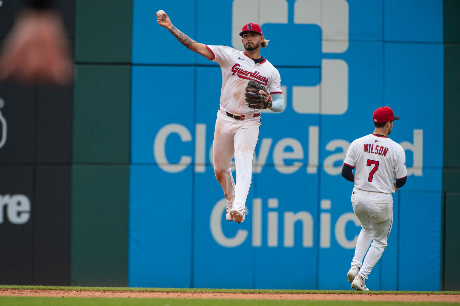 Cleveland Guardians' Gabriel Arias throws out Houston Astros' Victor Caratini as Will Wilson (7) avoids the play during the ninth inning of a baseball game, Saturday June 7, 2025, in Cleveland. (AP Photo/Phil Long)