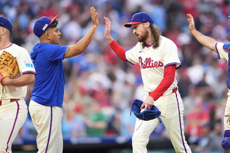 Philadelphia Phillies relief pitcher Matt Strahm (25) reacts with starting pitcher Ranger Suarez (55) after the game against the Toronto Blue Jays at Citizens Bank Park.Kyle Ross-Imagn Images