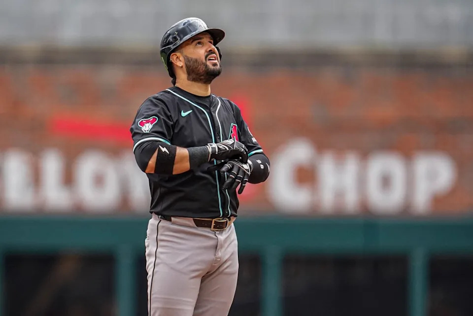 Arizona Diamondbacks third baseman Eugenio Suarez (28) reacts after hitting a double to drive in two runs against the Atlanta Braves during the ninth inning at Truist Park. IMAGN IMAGES via Reuters Connect
