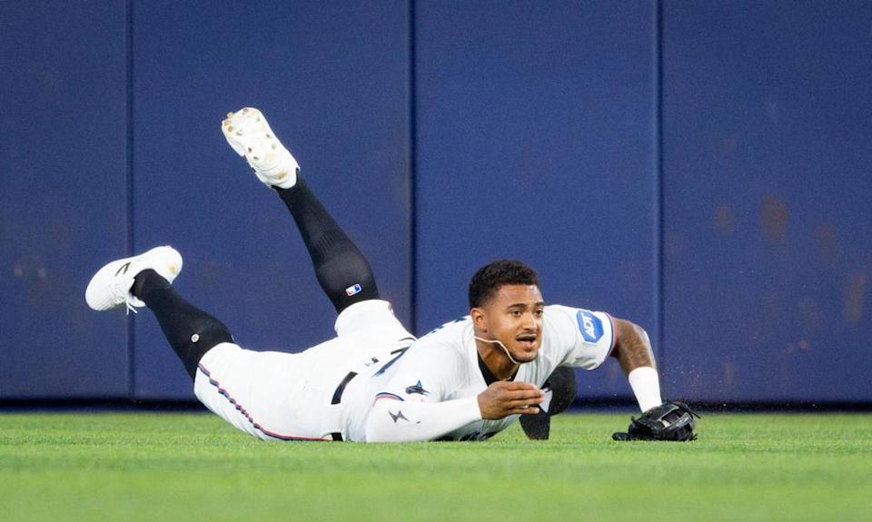 Miami Marlins outfielder Dane Myers (54) dives for a ball and catches it during the first inning of a game against the Philadelphia Phillies on Monday, June 16, 2025 at loanDepot Park in Miami, Fla.
