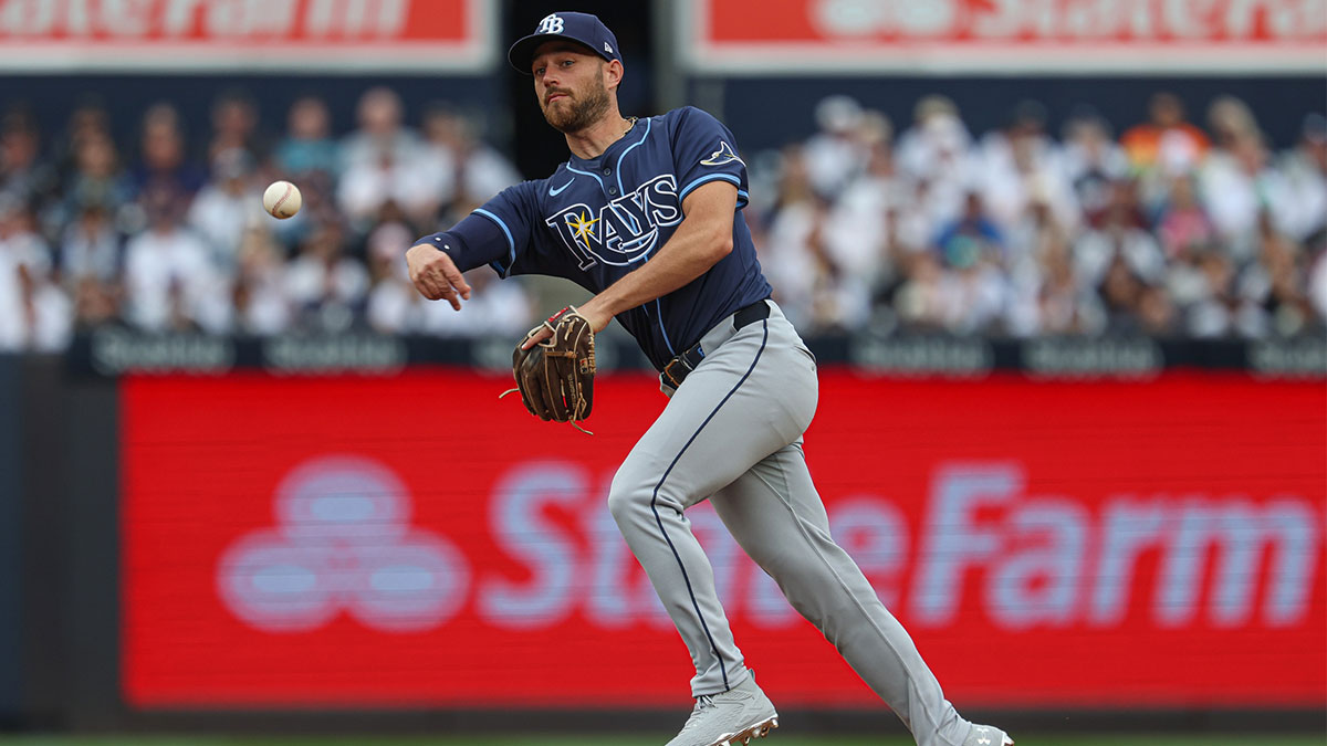 Tampa Bay Rays second baseman Brandon Lowe (8) throws the ball to first base for an out during the second inning against the New York Yankees at Yankee Stadium. 