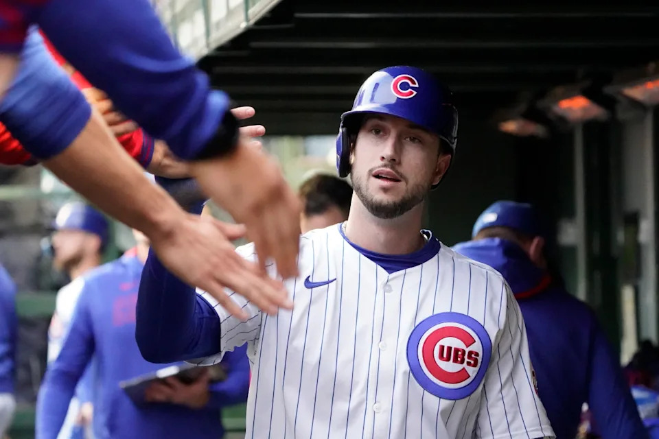 Chicago Cubs outfielder Kyle Tucker (30) is greeted in the dugout after scoring against the Colorado Rockies during the first inning at Wrigley Field.David Banks-Imagn Images