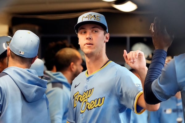 Milwaukee Brewers pitcher Jacob Misiorowski high-fives teammates after exiting a baseball game against the St. Louis Cardinals due to an ankle injury during the sixth inning of his major league debut Thursday, June 12, 2025, in Milwaukee. (AP Photo/Kayla Wolf)