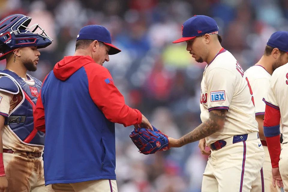 Philadelphia Phillies manager Rob Thomson hands the ball to pitcher Orion Kerkering during the eighth inning against the St. Louis Cardinals at Citizens Bank Park.Bill Streicher-Imagn Images