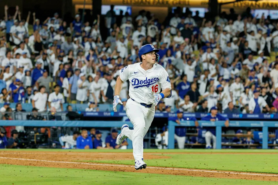 Will Smith (16) celebrates with teammates after hitting a walk-off home run in the ninth inning.