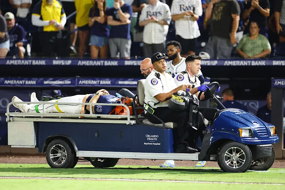 Junior Caminero #13 looks on as Hunter Bigge #43 of the Tampa Bay Rays is carted off.