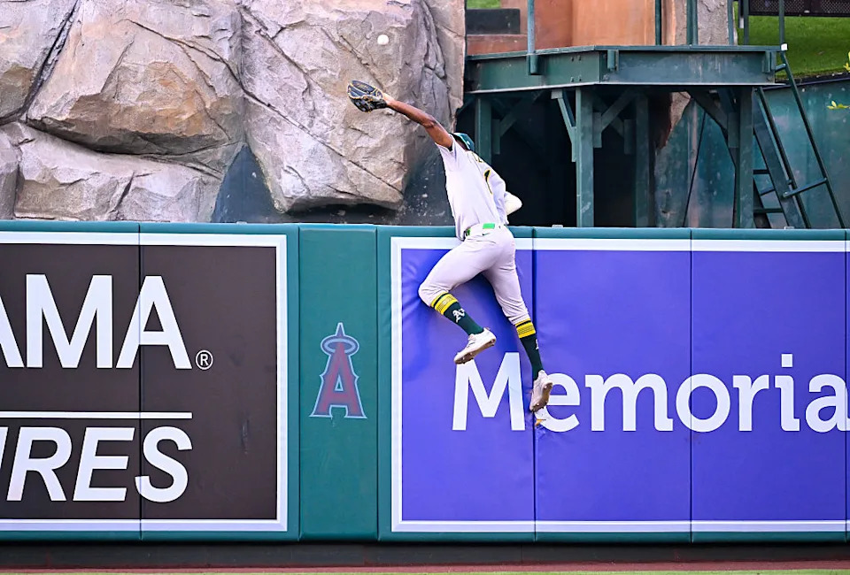 ANAHEIM, CALIFORNIA - JUNE 09: Denzel Clarke #1 of the Athletics catches a fly ball in the bottom of the first inning during the game between Athletics and Los Angeles Angels at Angel Stadium of Anaheim on June 09, 2025 in Anaheim, California. 