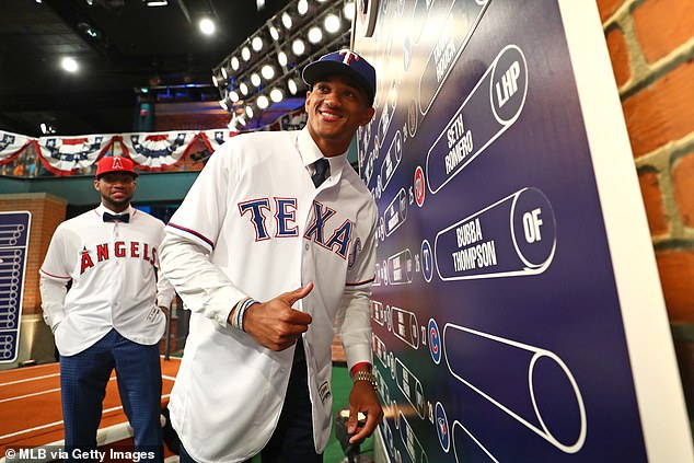 Bubba Thompson puts his name card on the draft board after being selected 26th overall by the Texas Rangers during the 2017 Major League Baseball Draft in Secaucus, New Jersey