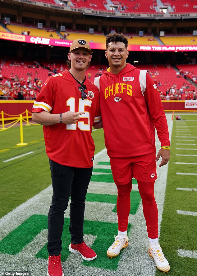 Patrick Mahomes #15 of the Kansas City Chiefs greets Bobby Witt Jr. of the Kansas City Royals prior to the game against the Las Vegas Raiders at Arrowhead Stadium on October 10, 2022
