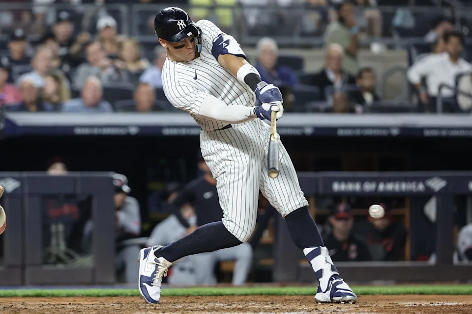 Jun 4, 2025; Bronx, New York, USA; New York Yankees right fielder Aaron Judge (99) hits a single in the sixth inning against the Cleveland Guardians at Yankee Stadium. Mandatory Credit: Wendell Cruz-Imagn Images
