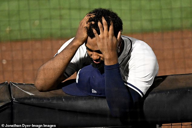 Rays third baseman Junior Caminero watches on as Bigge receives urgent medical attention