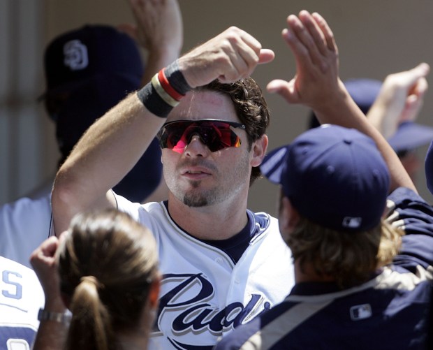 San Diego Padres' Ryan Klesko is congratulated upon returning to the dugout after scoring in a five-run Padres' rally against the San Francisco Giants in the third inning Sunday, July 3, 2005, in San Diego. (AP Photo/Lenny Ignelzi)