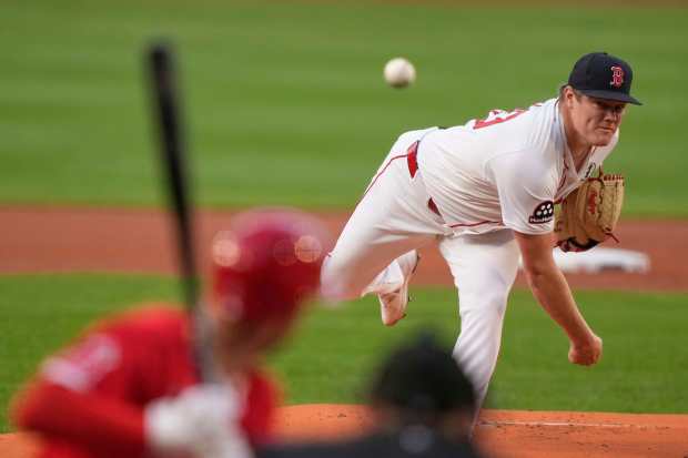 Boston Red Sox starting pitcher Richard Fitts throws to the...