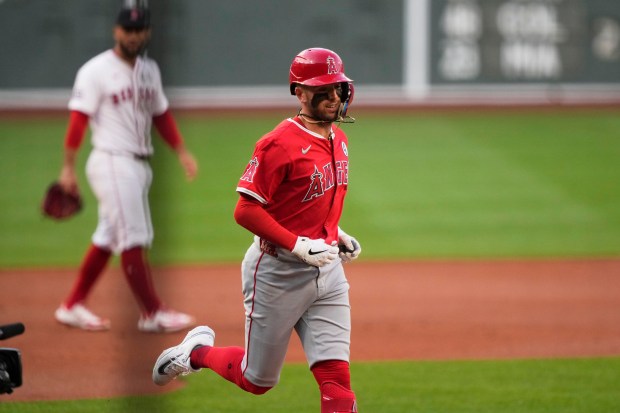 The Angels’ Zach Neto rounds the bases after hitting a...