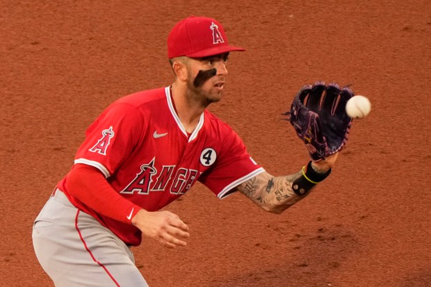 Angels shortstop Zach Neto fields a ball during the second...