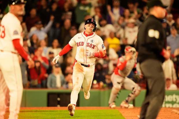 The Boston Red Sox’s Romy Gonzalez watches a ball he...