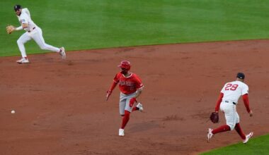 Los Angeles Angels' Zach Neto runs for home as a hit by Nolan Schanuel gets through Boston Red Sox third baseman Abraham Toro (29) and shortstop Trevor Story (10) in the third inning of a baseball game, Tuesday June 3, 2025, in Boston. (AP Photo/Robert F. Bukaty)