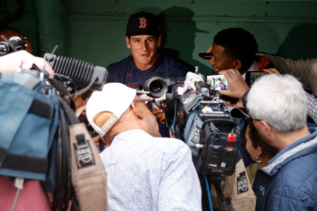 Boston Red Sox outfielder Roman Anthony speaks with the media in the dugout before making his first major league start in a baseball game against the Tampa Bay Rays at Fenway Park, Monday, June 9, 2025, in Boston. (AP Photo/Mary Schwalm)