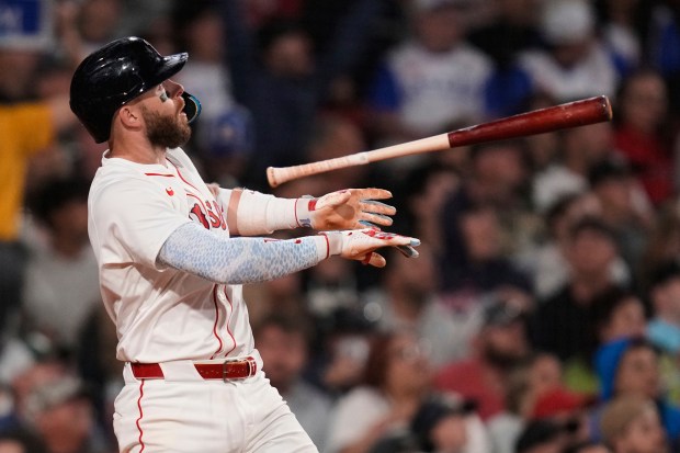 Boston Red Sox' Trevor Story watches the flight of his solo home run off Tampa Bay Rays pitcher Ryan Pepiot during the sixth inning of a baseball game at Fenway Park, Tuesday, June 10, 2025, in Boston. (AP Photo/Charles Krupa)