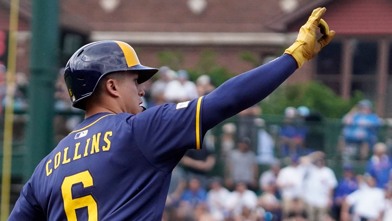 Milwaukee Brewers' Isaac Collins gestures after hitting a three-run home run against the Chicago Cubs during the fifth inning of a baseball game Thursday, June 19, 2025, in Chicago. (AP Photo/David Banks)