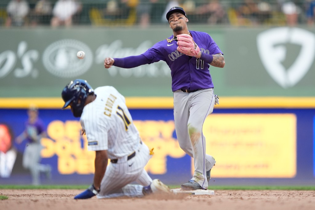 Rockies beat Brewers in 11th for first extra-inning win of season